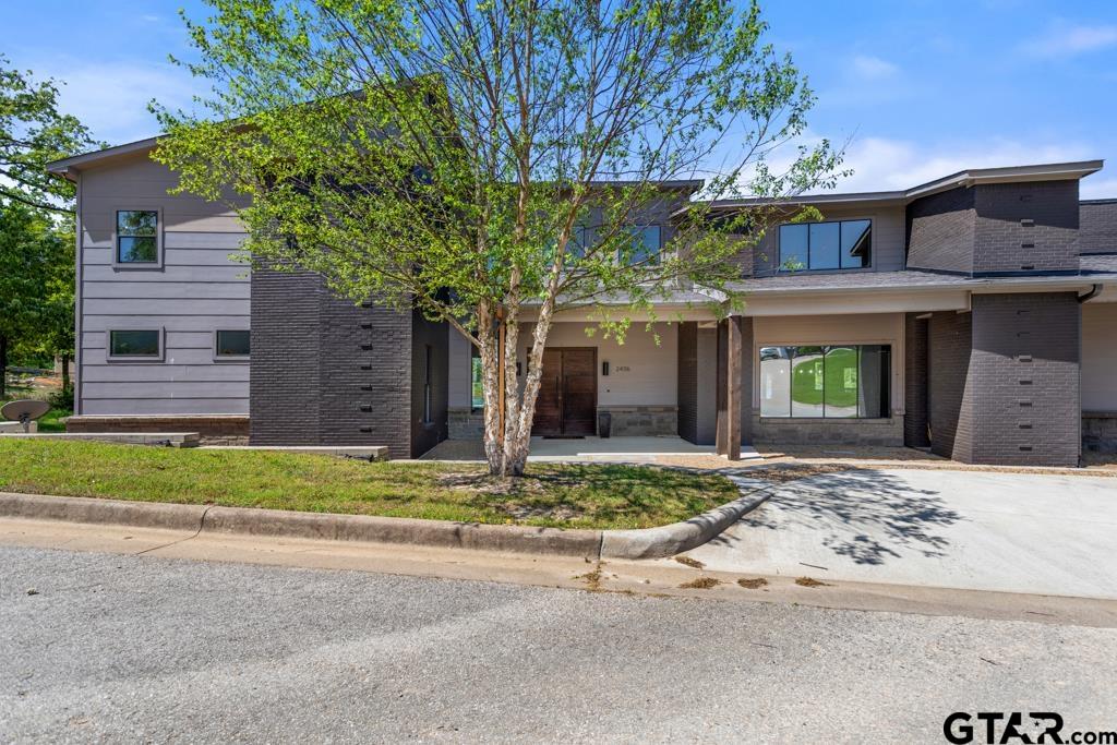 24116 Sun Ridge Road Lindale, TX 75771 - Photo 3 of 47 a front view of a house with a yard and garage
