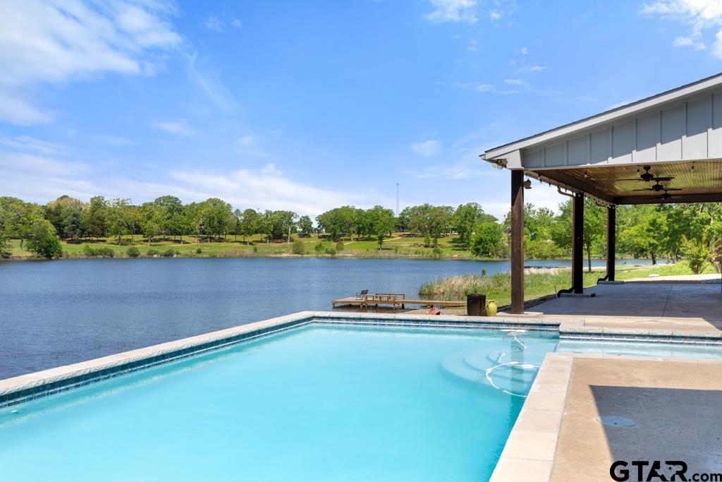 24116 Sun Ridge Road Lindale, TX 75771 - Photo 4 of 47 a view of swimming pool with a yard and outdoor seating