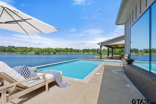 a view of a swimming pool with a patio