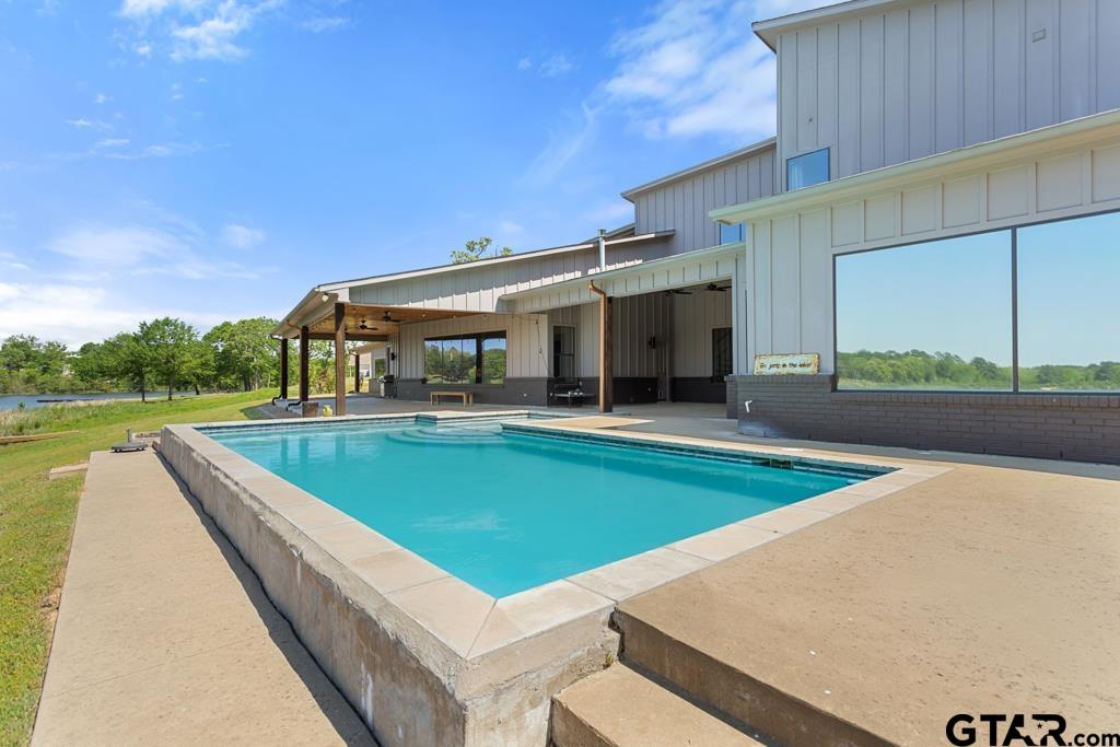 24116 Sun Ridge Road Lindale, TX 75771 - Photo 43 of 47 a view of a swimming pool with a patio