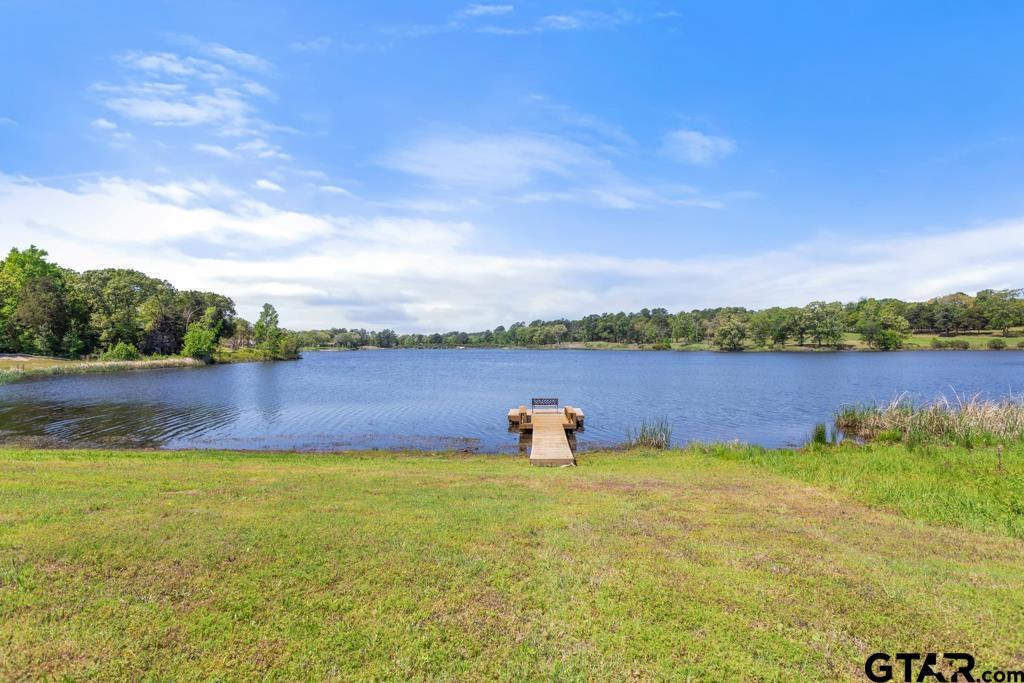 24116 Sun Ridge Road Lindale, TX 75771 - Photo 45 of 47 a view of a lake with houses in the back