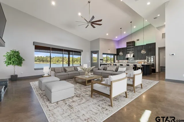 a living room with furniture and a large window