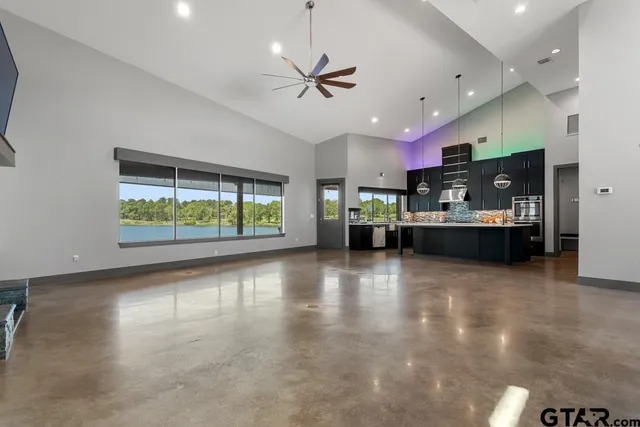 a view of kitchen and kitchen with furniture stove and window