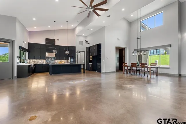 a view of kitchen and dining room with furniture and wooden floor