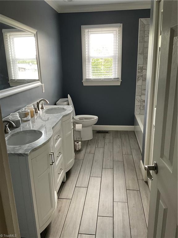 1202 Pilot School Road Thomasville, NC 27360 - Photo 15 of 15 This open living/kitchen/dining floor plan is inviting.