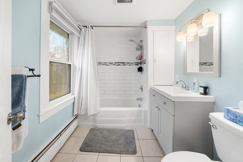 653 Walnut Plain Road Rochester, MA 02770 - Photo 16 of 30 a bathroom with a sink a toilet a mirror and shower