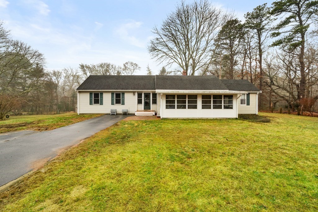 653 Walnut Plain Road Rochester, MA 02770 - Photo 2 of 30 a house with swimming pool in front of it