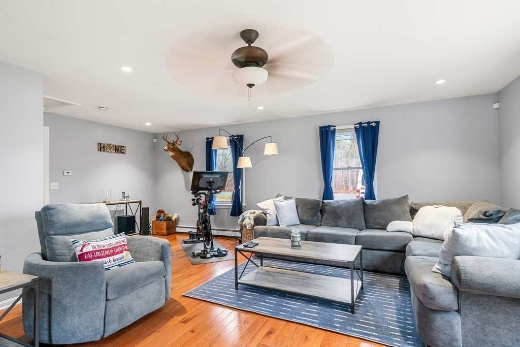 653 Walnut Plain Road Rochester, MA 02770 - Photo 7 of 30 a living room with furniture and a rug