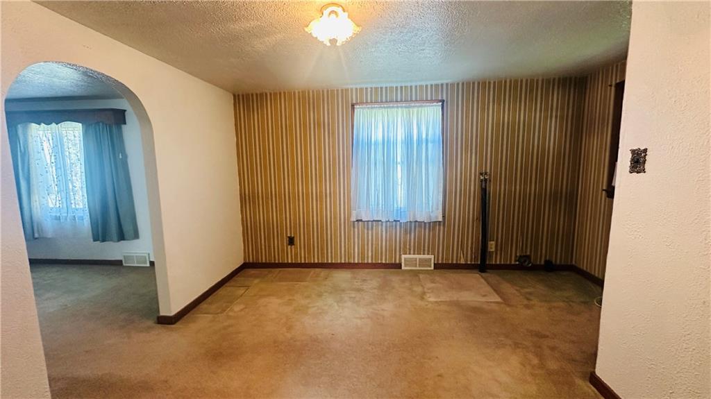 708 Lardintown Road Tarentum, PA 15084 - Photo 26 of 47 Dining room with laundry room hookups. If you need a first floor laundry, this is it. Curved arches.