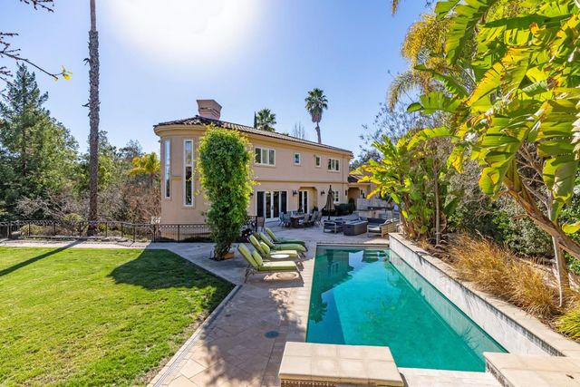a view of backyard with seating space