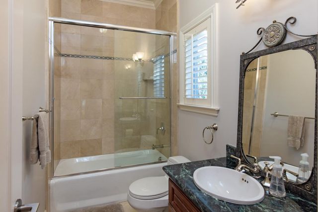 a view of a pathway both side of house