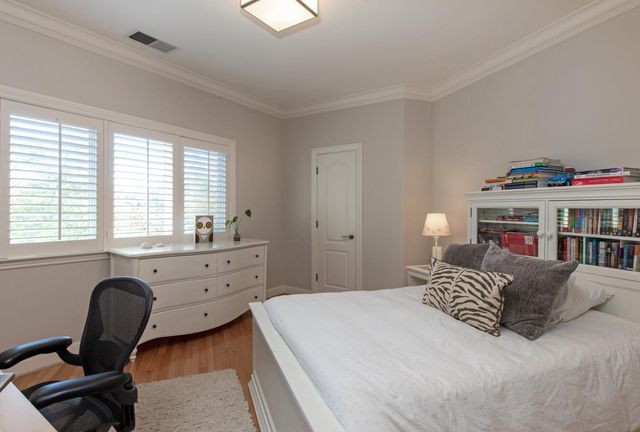 a living room with furniture a fireplace and a large window