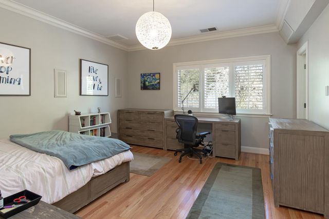 a spacious bathroom with a bathtub shower sink double and mirror