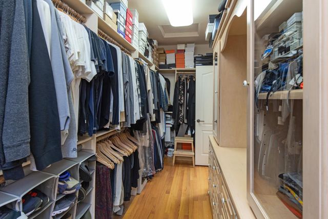 a bathroom with a tub a window and a shower