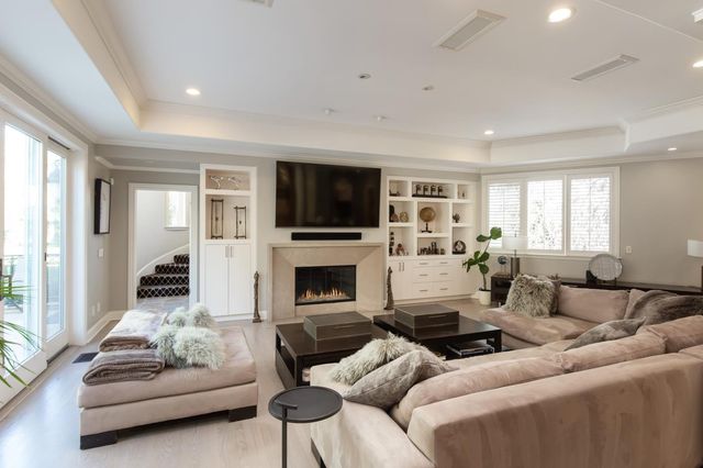 a room with furniture a rug and a window