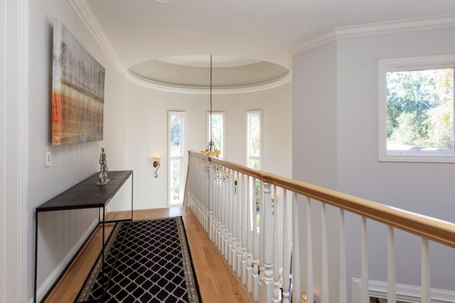 a view of a wooden floor with a white house