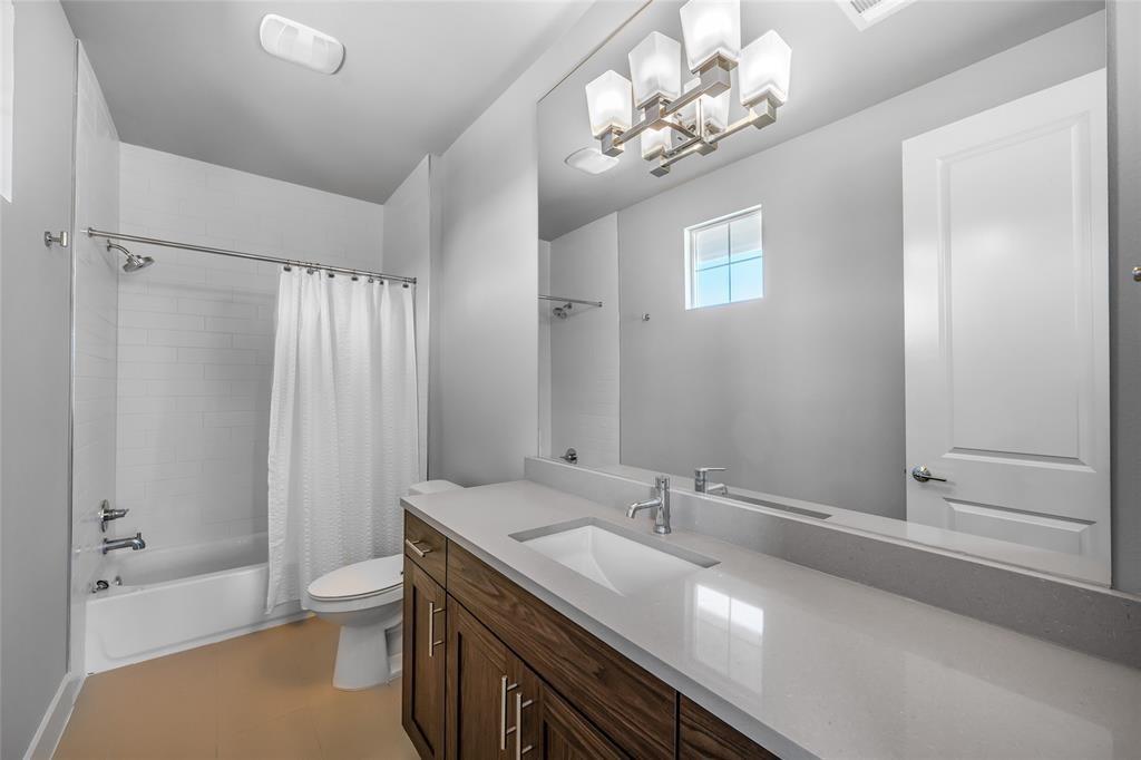 7807 Ryans Way Austin, TX 78726 - Photo 11 of 16 a bathroom with a granite countertop sink a toilet and shower