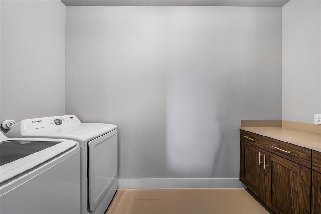 7807 Ryans Way Austin, TX 78726 - Photo 14 of 16 a utility room with dryer and washer