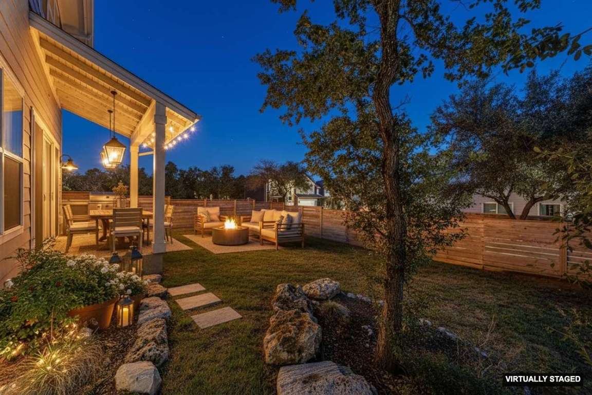 7807 Ryans Way Austin, TX 78726 - Photo 15 of 16 a backyard of a house with table and chairs