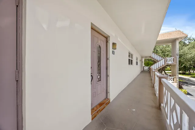 a view of a hallway with seating area