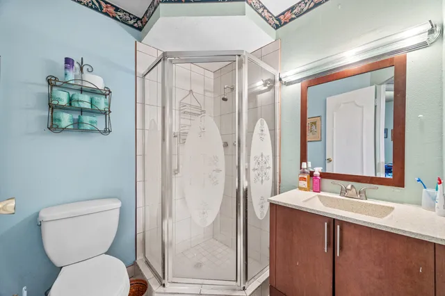 a bathroom with a toilet sink and shower