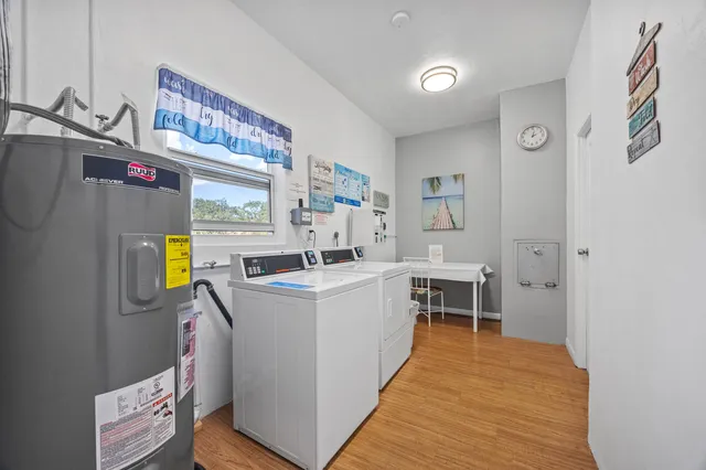 a kitchen with stainless steel appliances a stove a sink and a refrigerator
