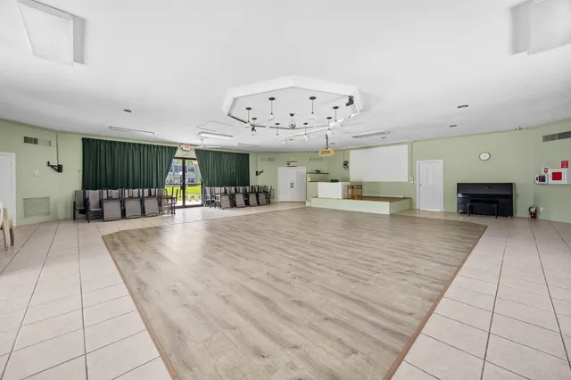 a view of a living room and kitchen with furniture