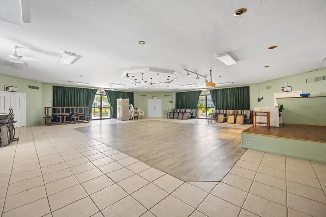 a view of a living room and kitchen