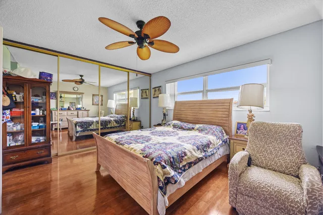 a bed room with a bed and a chandelier