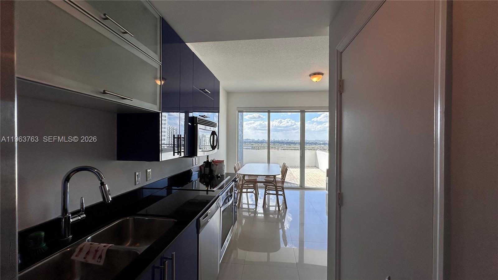60 Southwest 13th Street, Unit 1115 Miami, FL 33130 - Photo 10 of 11 a lobby with furniture and window