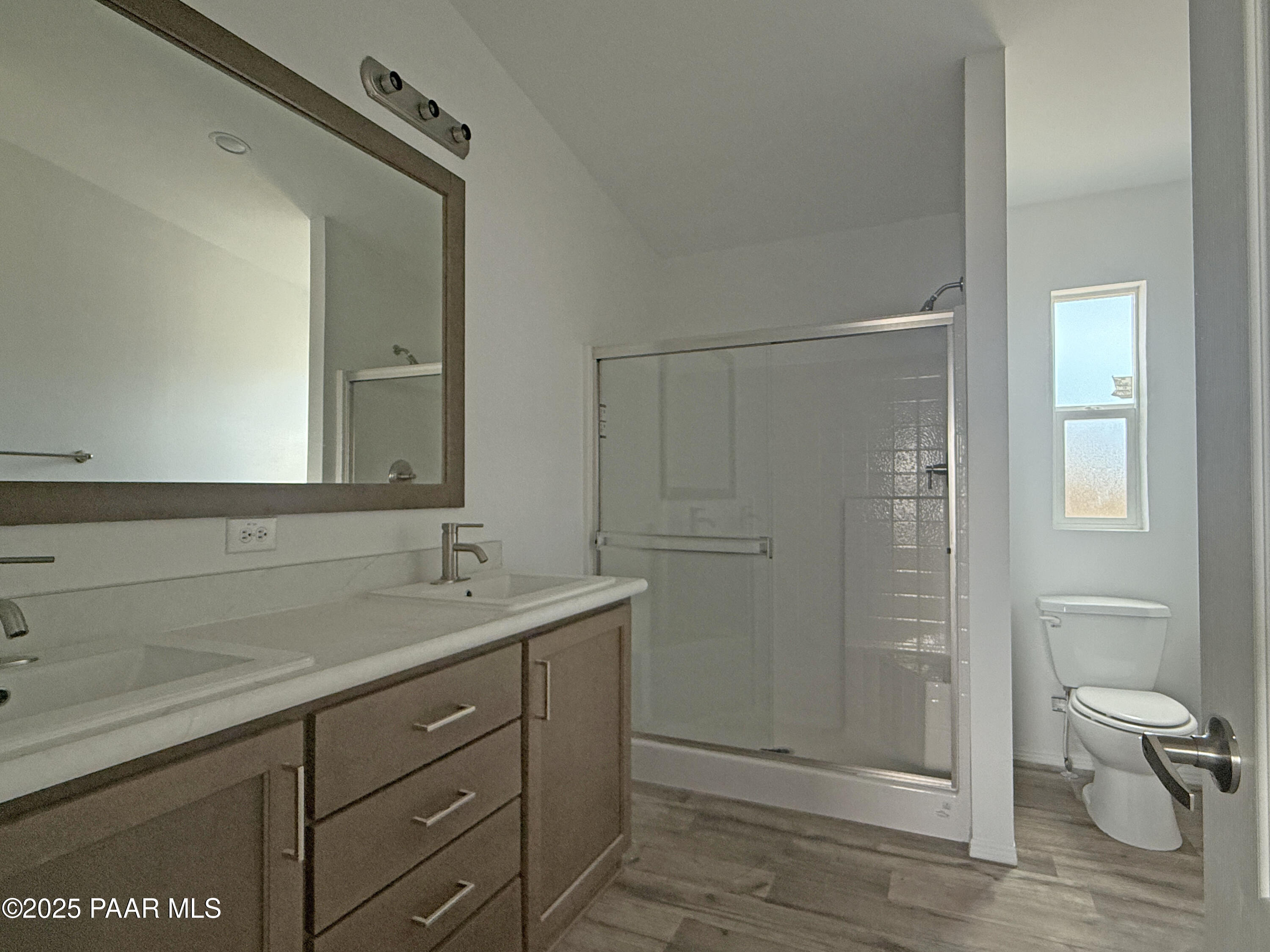 367 Antelope Run Road Paulden, AZ 86334 - Photo 10 of 17 a bathroom with a granite countertop sink a toilet and shower