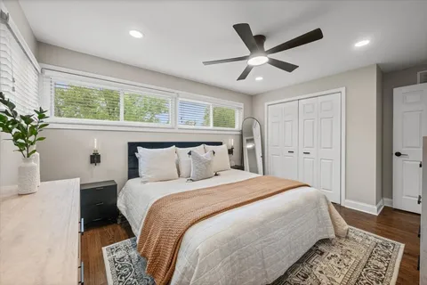 a bed room with a bed and a window