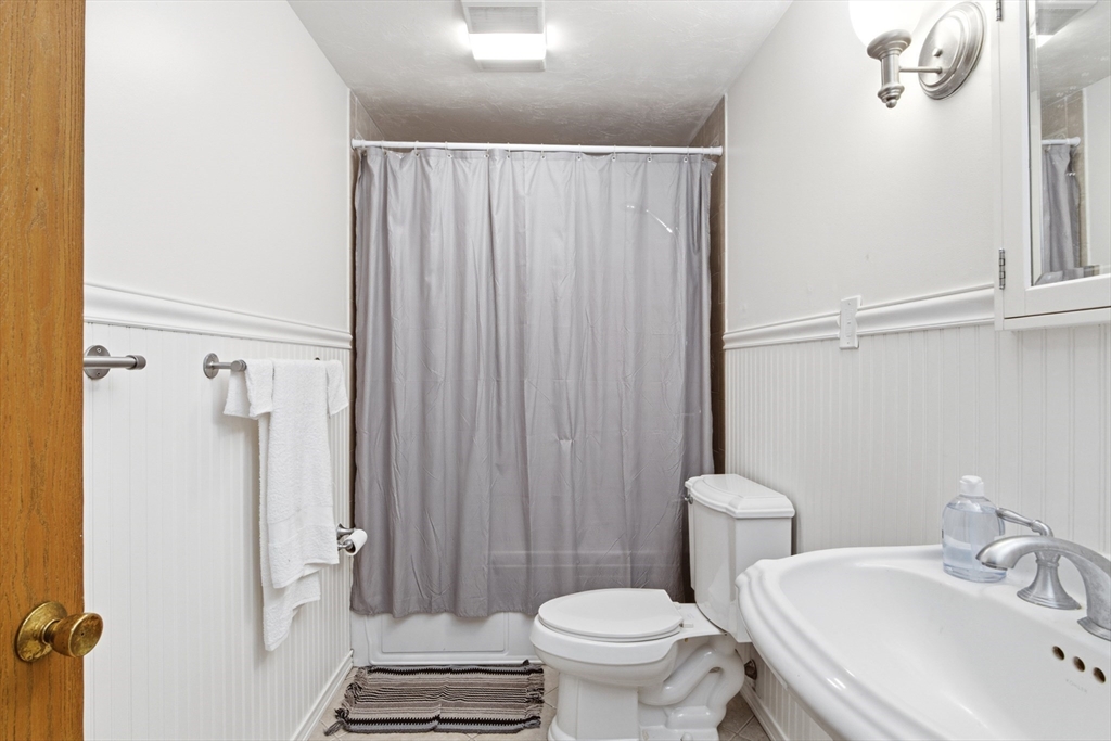 356 Neponset Street, Unit E Canton, MA 02021 - Photo 5 of 22 a bathroom with a sink toilet and shower