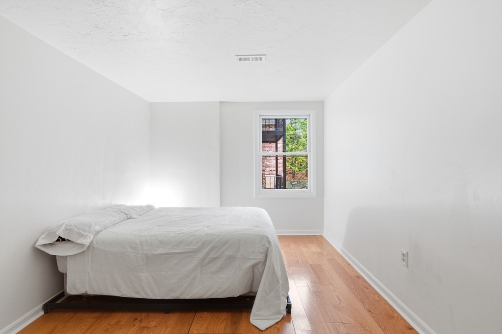 356 Neponset Street, Unit E Canton, MA 02021 - Photo 7 of 22 a bedroom with a bed and a window