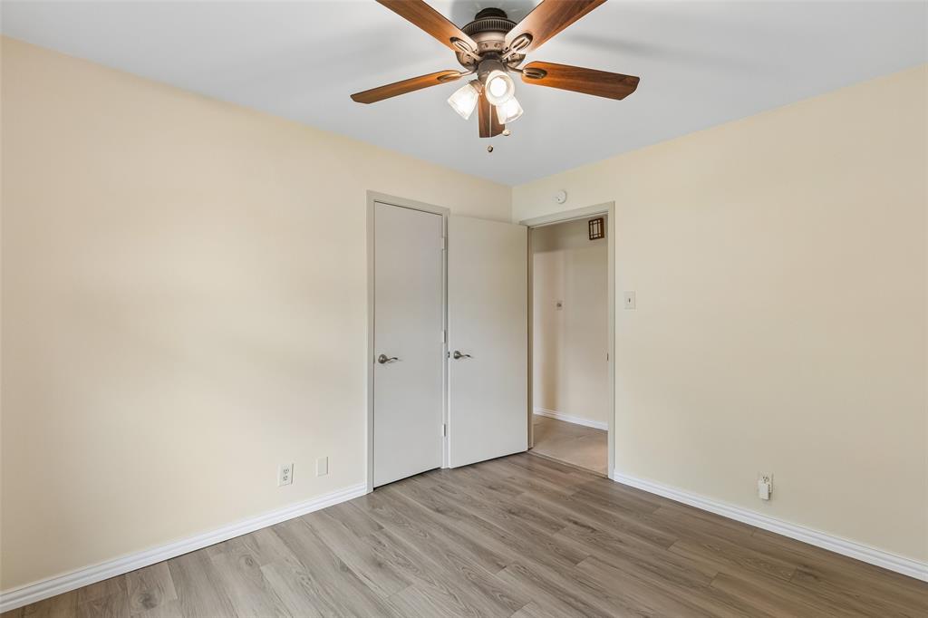 1548 Timbercreek Drive Howe, TX 75459 - Photo 14 of 24 a view of a room with wooden floor and a ceiling fan