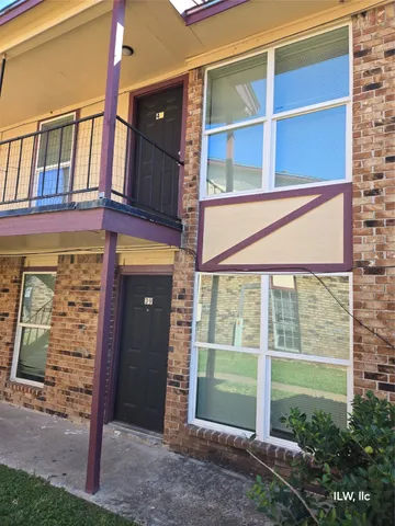 a view of a house with a large window