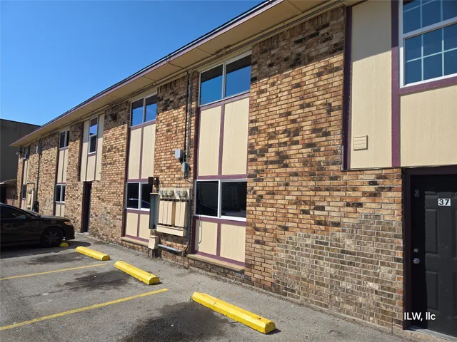 a view of a building with a yard