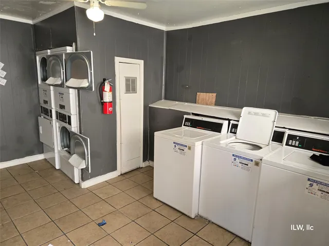 a work room with furniture and a flat screen tv