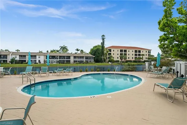 a view of a swimming pool and a chair