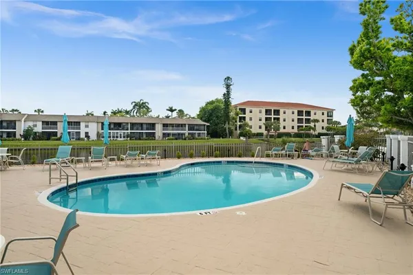 a view of a swimming pool and a chairs