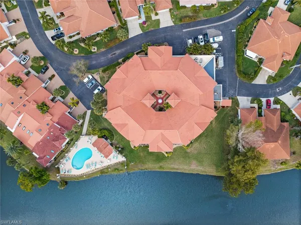 an aerial view of a house with outdoor space and garden