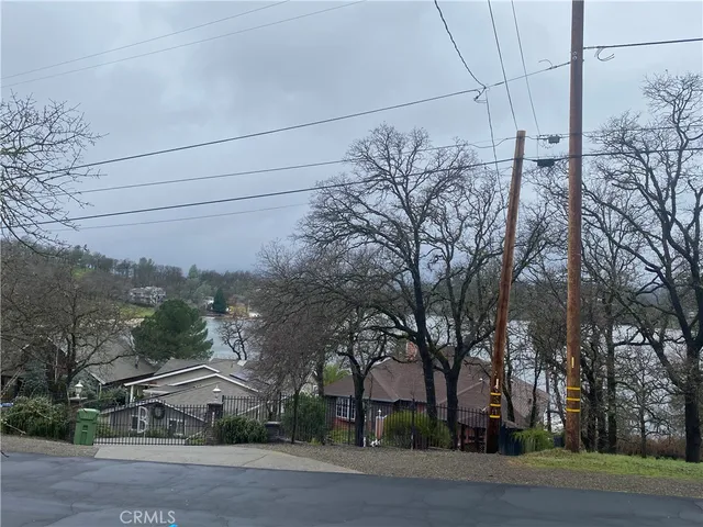 a view of a white house and a road
