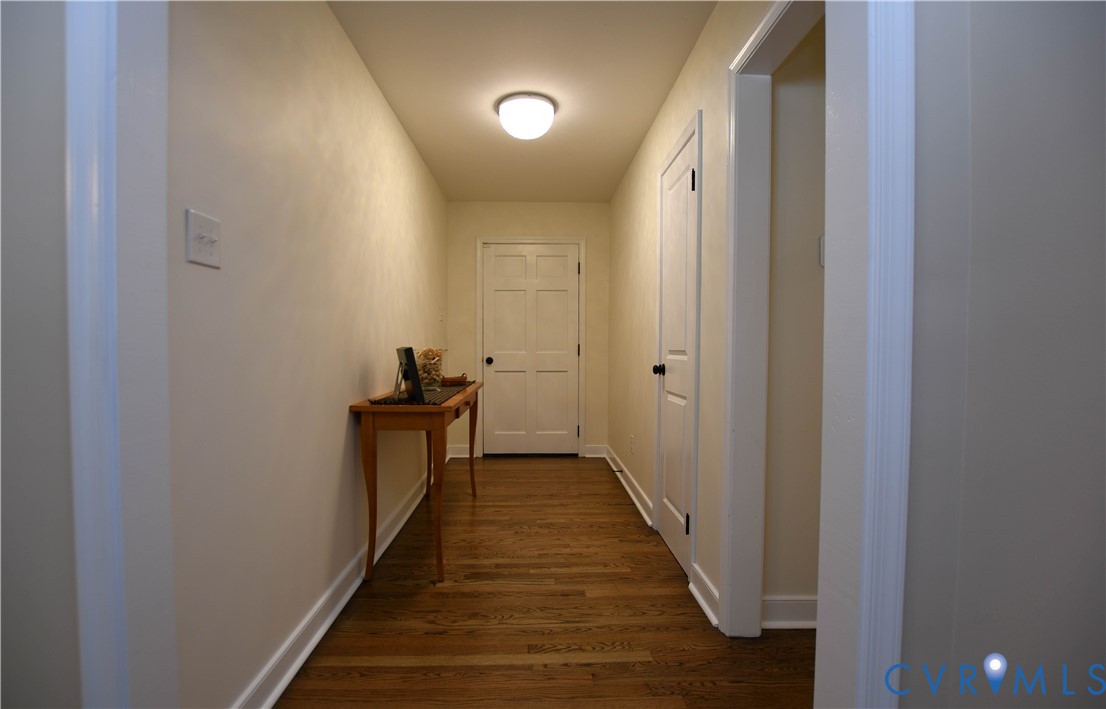 1448 Canterbury Road St. Stephens Church, VA 23148 - Photo 2 of 57 Hallway featuring hardwood floors, light-toned wal