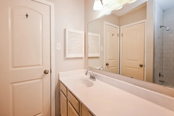 a bathroom with a bathtub and shower