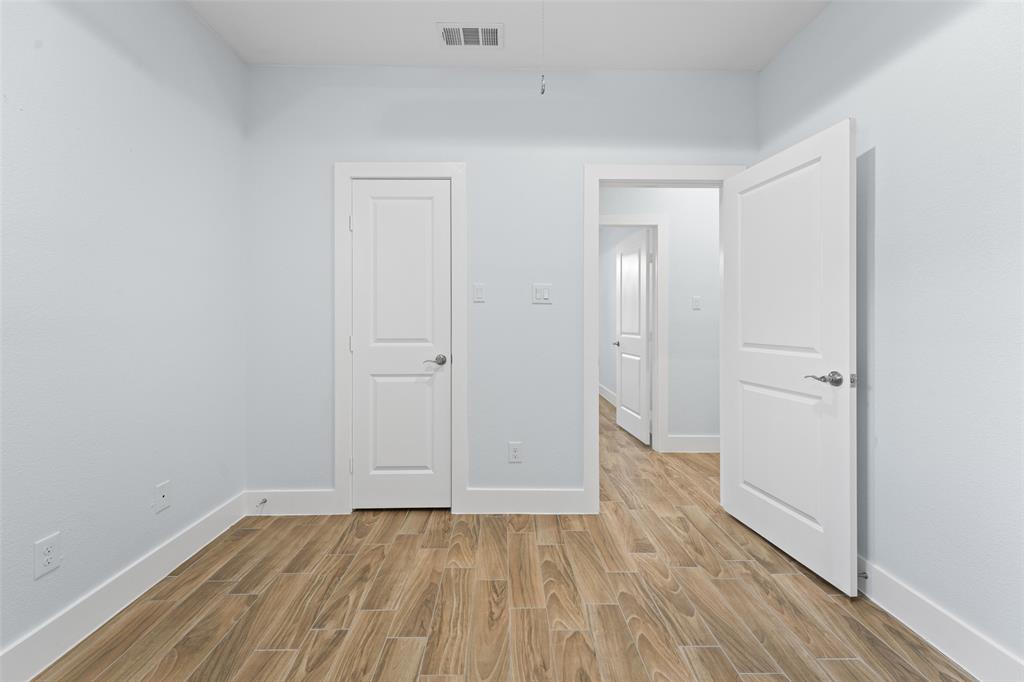 3807 Winding Road Arlington, TX 76016 - Photo 16 of 23 Neutral walls with wood-finish flooring