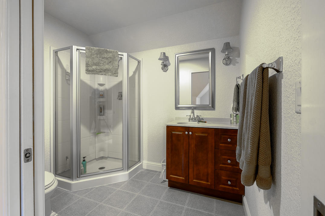 375 Hamilton Road Jacksonville, OR 97530 - Photo 31 of 47 a bathroom with a granite countertop sink mirror and shower