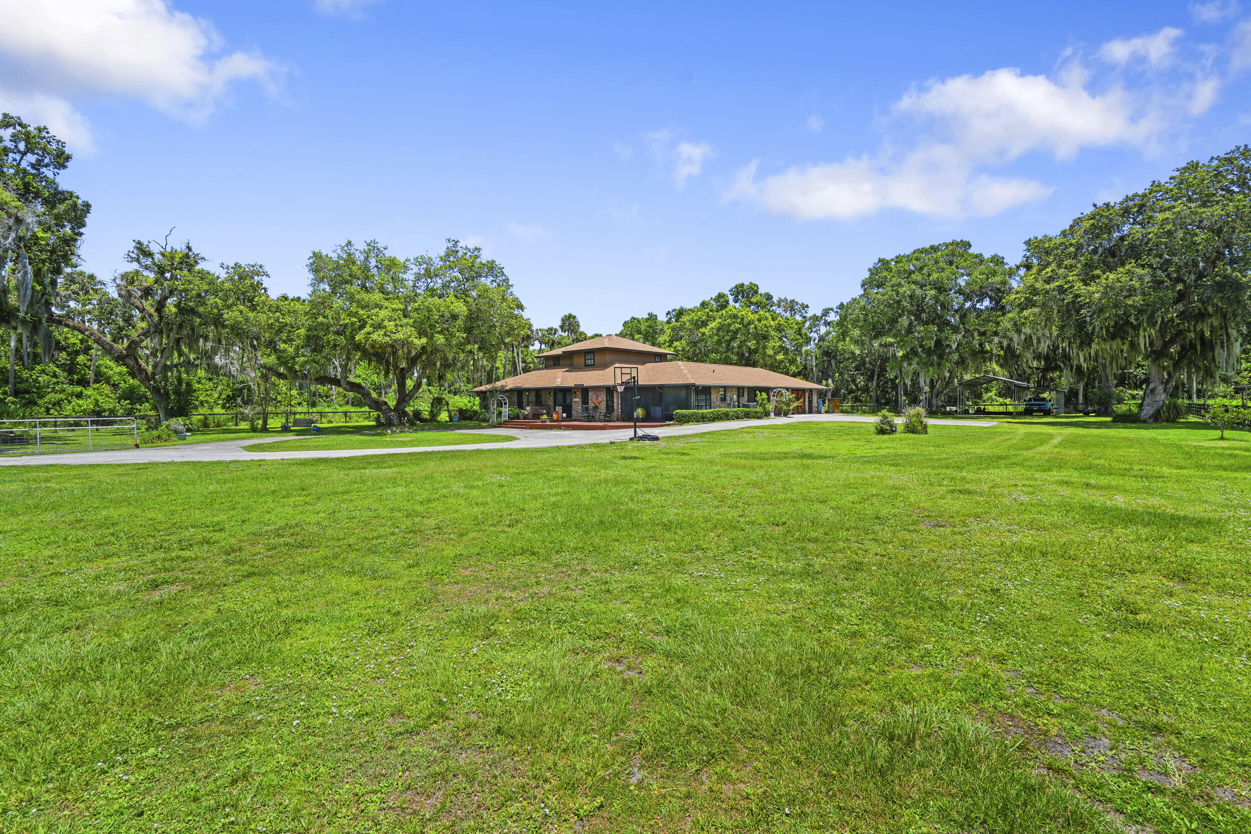 4170 McCarty Road Fort Pierce, FL 34945 - Photo 49 of 57 a view of a green field with house in the background