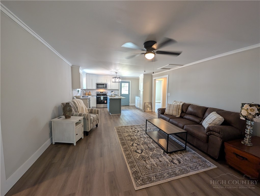 68 Estep Street Sparta, NC 28675 - Photo 8 of 21 a living room with furniture and wooden floor
