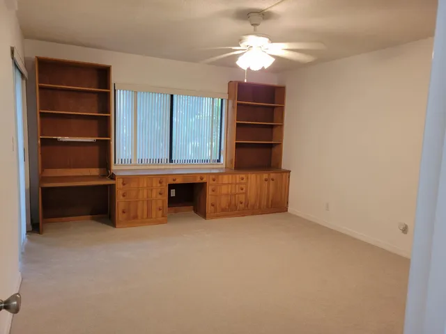 a bathroom with a sink a light fixture and a mirror