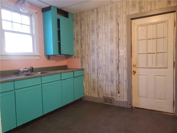 a room with mirror and a window